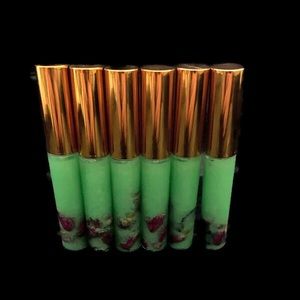 Lip glosses oil with roes buds